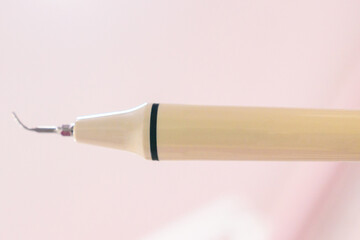 Periodontal ultrasonic scaler, tartar removal, scaler close up.