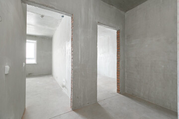 interior of the apartment without decoration in gray colors. rough finish