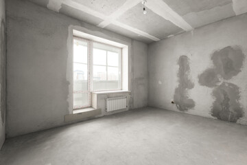 interior of the apartment without decoration in gray colors. rough finish