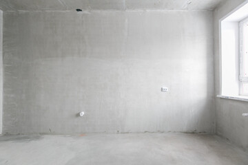 interior of the apartment without decoration in gray colors. rough finish