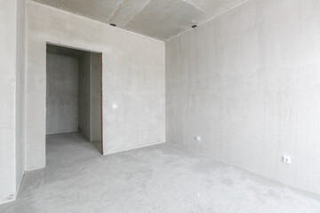 interior of the apartment without decoration in gray colors. rough finish