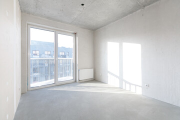 interior of the apartment without decoration in gray colors. rough finish