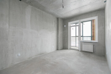 interior of the apartment without decoration in gray colors. rough finish