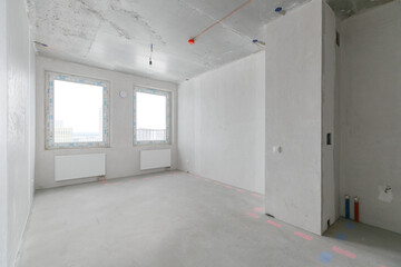 interior of the apartment without decoration in gray colors. rough finish