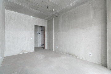 interior of the apartment without decoration in gray colors. rough finish