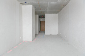 interior of the apartment without decoration in gray colors. rough finish