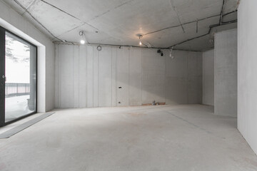 interior of the apartment without decoration in gray colors. rough finish