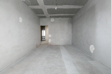 interior of the apartment without decoration in gray colors. rough finish
