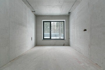 interior of the apartment without decoration in gray colors. rough finish