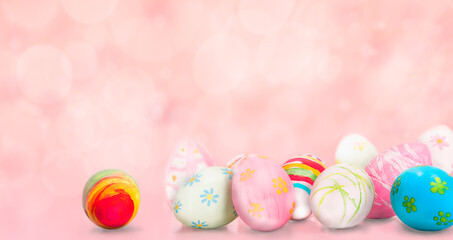 Fototapeta na wymiar Painted Easter eggs on pastel pink background