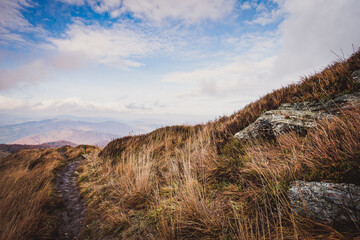 Autumn in the Bieszczady Mountains Poland. Trekking trail, blue sky.
