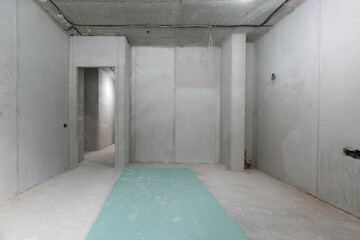 interior of the apartment without decoration in gray colors. rough finish