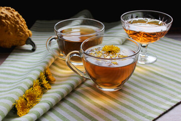 Cup of healthy dandelion tea with honey. Vitamin drink. Herbal medicine. Copy space.