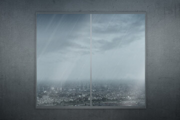 Window glass with view of urban life with rain