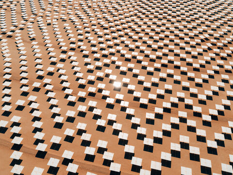 Aerial view of Solar Park plant with white panels in the middle of the desert, Dubai, United Arab Emirates. - Powered by Adobe