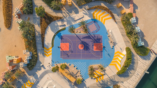 Aerial view of a Basketball playground at the Skate Park the Block along Dubai Creek, Dubai, United Arab Emirates. - Powered by Adobe