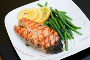 Grilled salmon steak with green beans