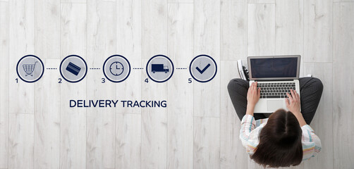 Woman with laptop using delivery service application, top view