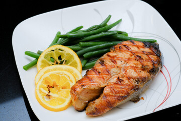 Grilled salmon steak with green beans