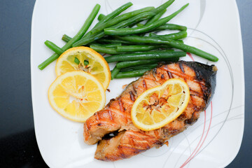 Grilled salmon steak with green beans