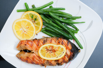 Grilled salmon steak with green beans