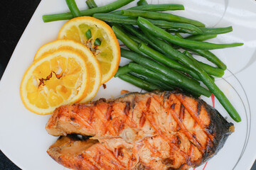 Grilled salmon steak with green beans