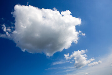 Naklejka na ściany i meble Blue sky with big clouds. Nature background.