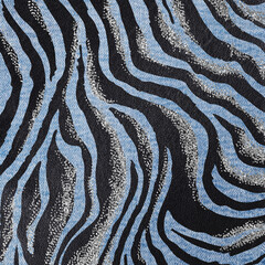 Modern African backdrop with zebra prints. Denim and leather with silver decoration
