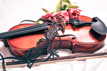 Music and Violin at the Theater. Venetian mask with old fiddle composition