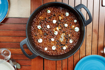 Typical mediterranean rice with aioli and camalari