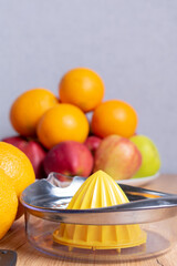 Manual juicer and fruits: oranges, apples. Healthy drinks