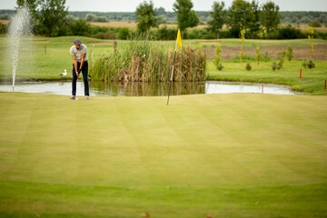 Young man playing golf