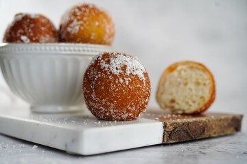 Chinese deep fried round Sugar Dnuts or Doughnuts on white background, selective focus