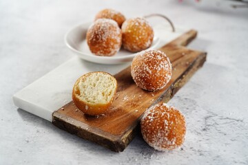 Chinese deep fried round Sugar Dnuts or Doughnuts on white background, selective focus