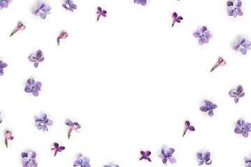 Frame of violet blue flowers lilac ( Syringa vulgaris ) on a white background with space for text. Spring flowers. Top view, flat lay