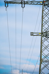power pole in front of blue sky