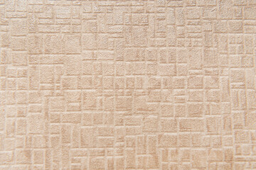beige wallpaper with embossed geometric pattern, top view
