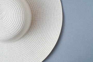 Fototapeta na wymiar A large white beach lady's hat on a pastel beige background. The concept of vacation, vacation, travel, sales, black Friday.