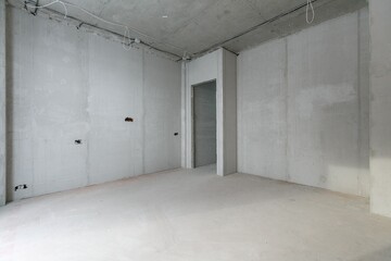 interior of the apartment without decoration in gray colors. rough finish