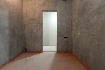 Fototapeta premium interior of the apartment without decoration in gray colors. rough finish