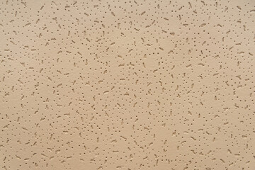 beige, embossed textured background, top view