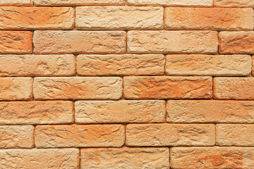 bright, orange brick wall background, top view