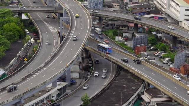 4K Timelapse of traffic on highway road junctions in Bangkok, Thailand since Public transport, lifestyle, traveler, concept of urban life in Asia, bird's eye view
