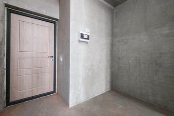 interior of the apartment without decoration in gray colors. rough finish