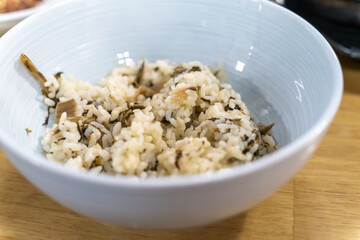 Siraegi rice in Korea is steamed rice cooked with dried radish greens.