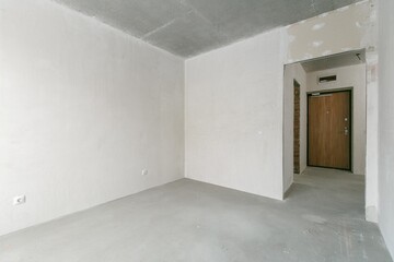 interior of the apartment without decoration in gray colors. rough finish
