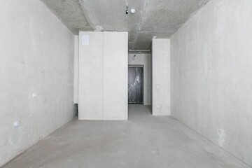 interior of the apartment without decoration in gray colors. rough finish