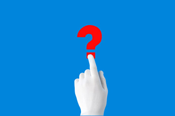 the index finger points to a red question mark on a blue background.