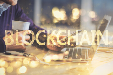 Double exposure of man's hands holding and using a phone and crypto currency blockchain theme drawing.