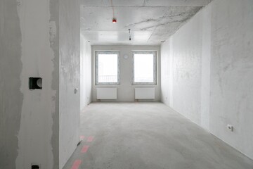 interior of the apartment without decoration in gray colors. rough finish